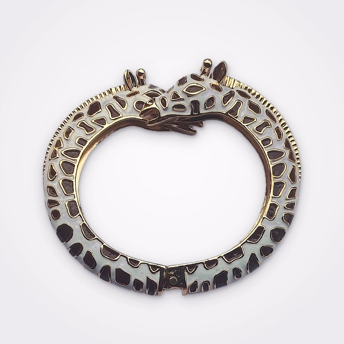 Gold Tone Double Headed Giraffe Statement Bangle In White And Brown Enamel