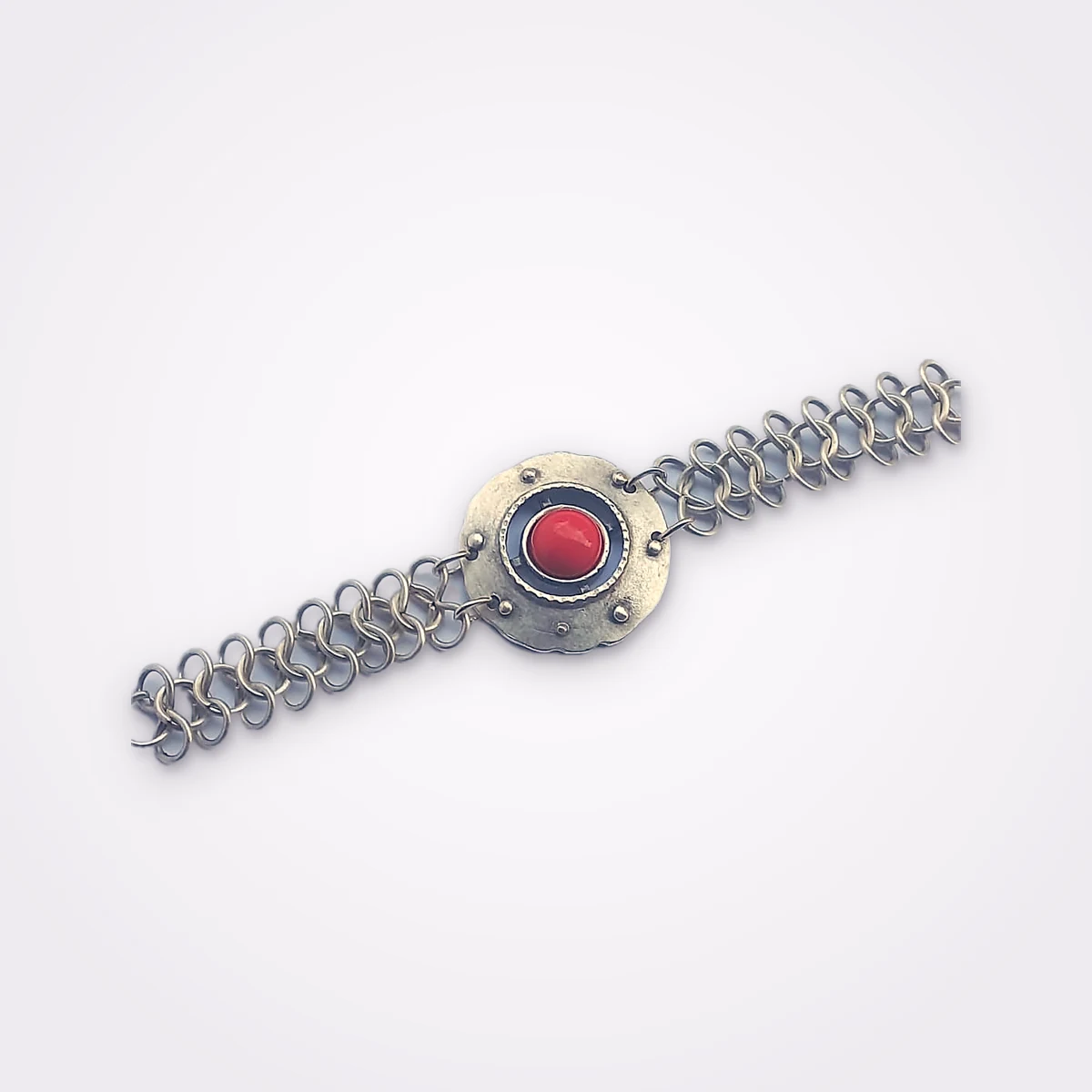 Silver Plated Tribal Bracelet With Garter Weave Links And A Central Red Stone